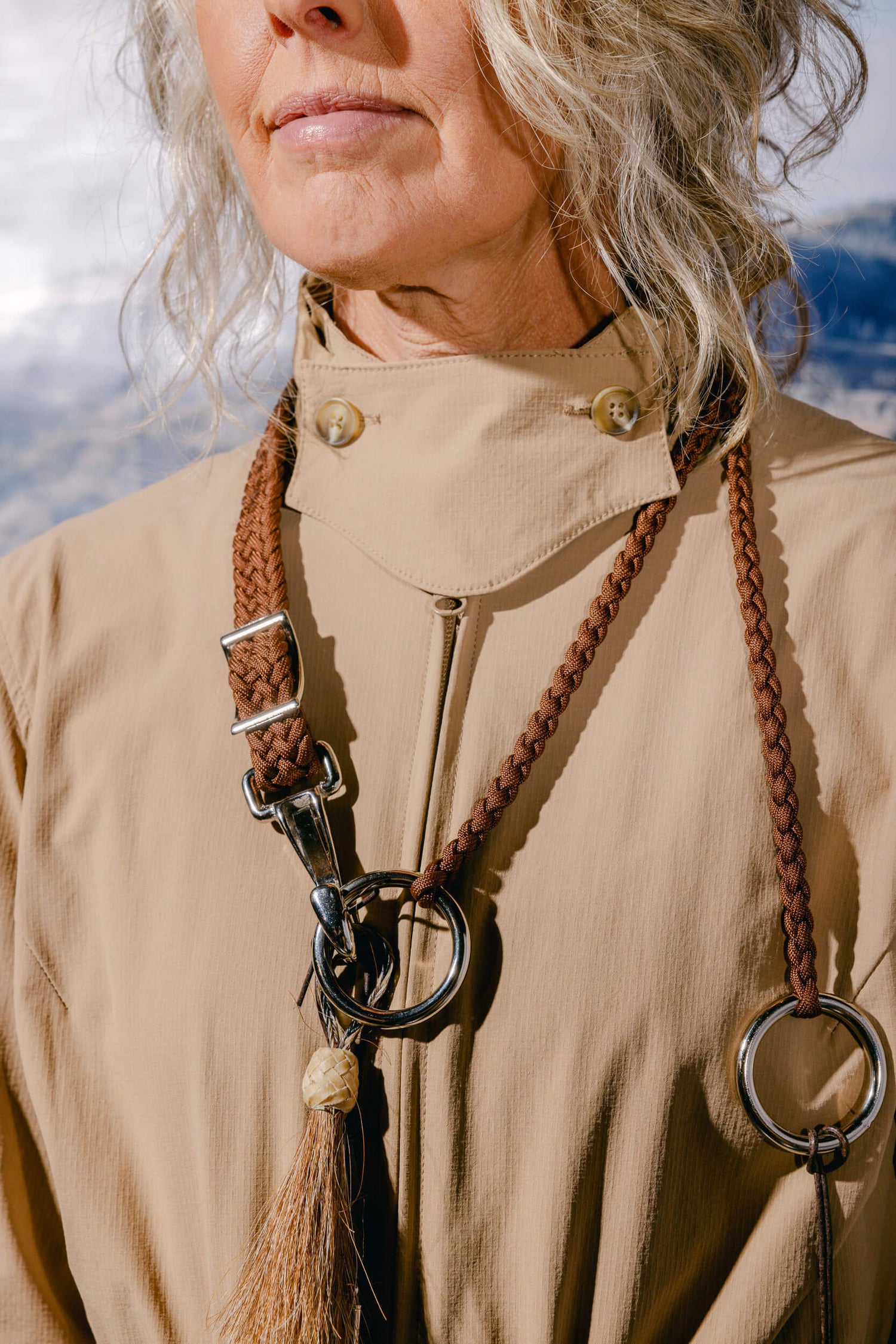 Woman wearing The Huntress Outdoor Tackle Suit and Bridle Necklace