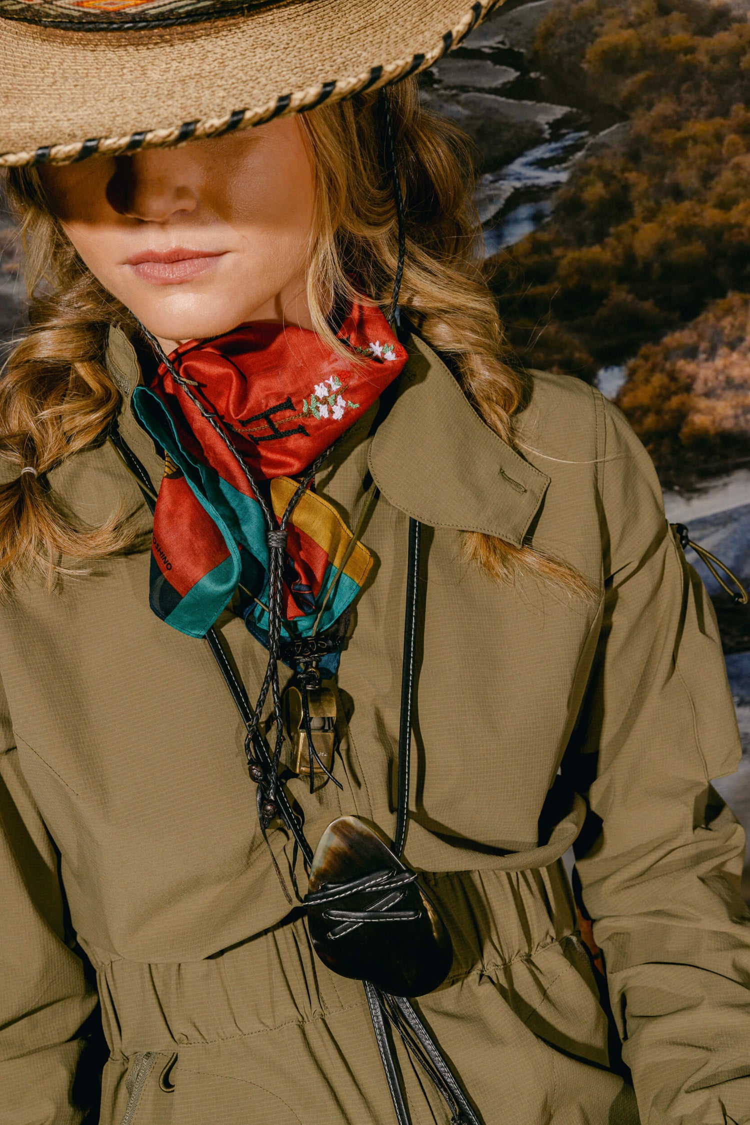 Woman wearing the Sage Tackle Suit, Bandana and Leather Fly Whistle Necklace