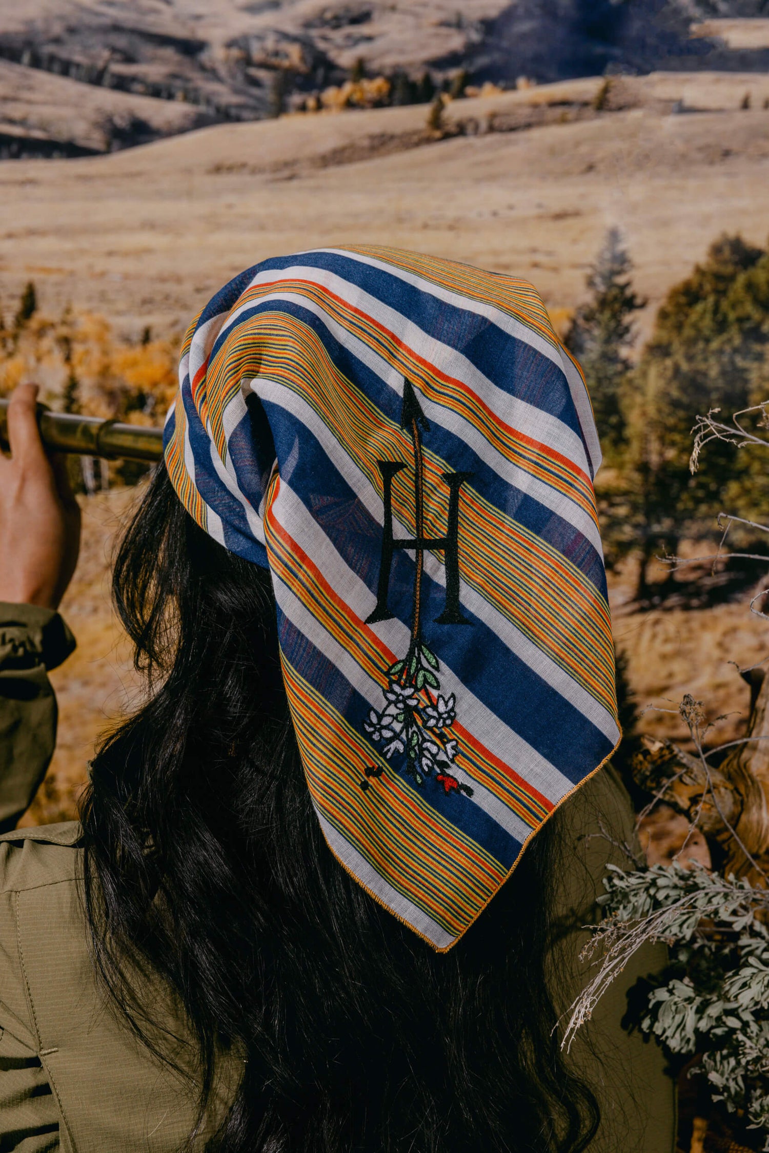 Woman wearing The Huntress Outdoor striped bandana