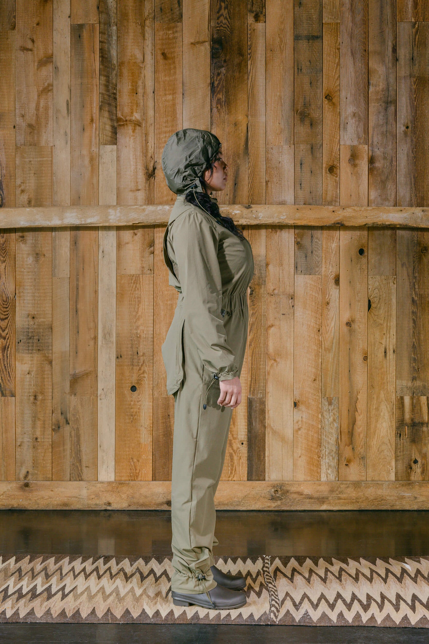 The Huntress Outdoor Tackle Suit side view with hood in Sage