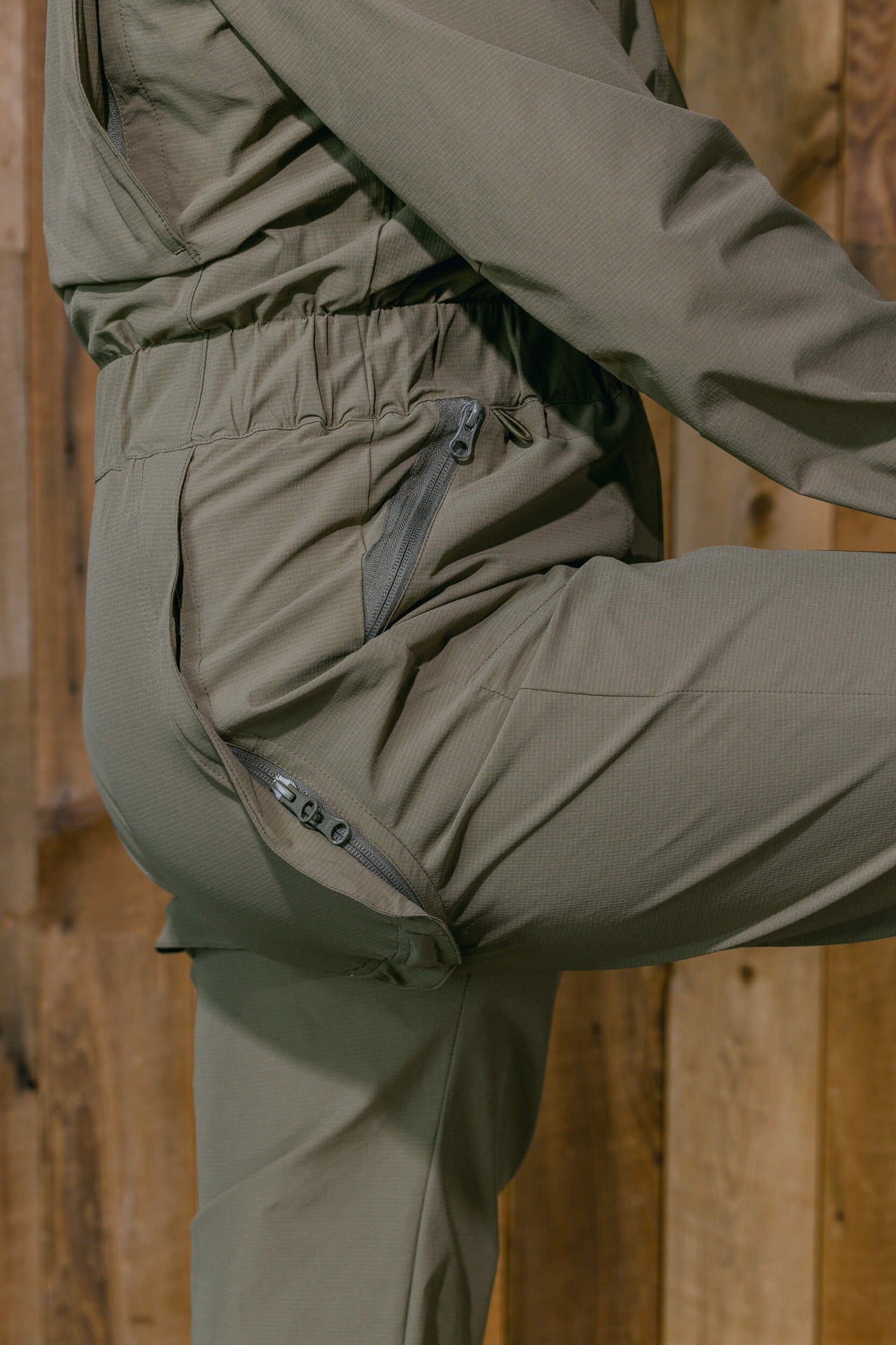 The Huntress Outdoor Tackle Suit rear flap detail in Sage